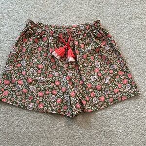 Olive green and pink satin feel draw string shorts. Side pockets. Cabana life